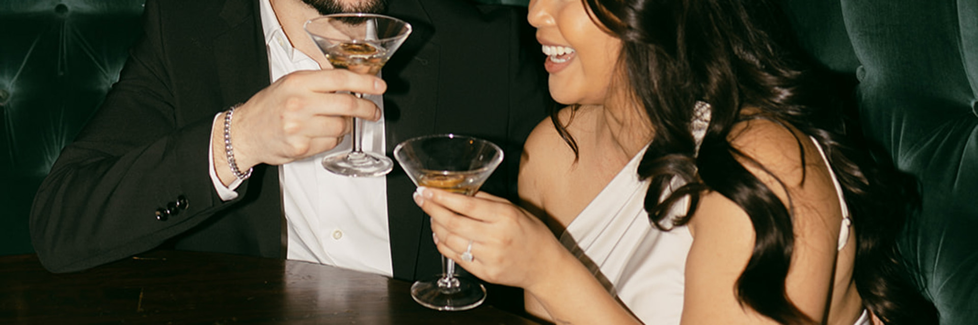 Couple toasting with martinis
